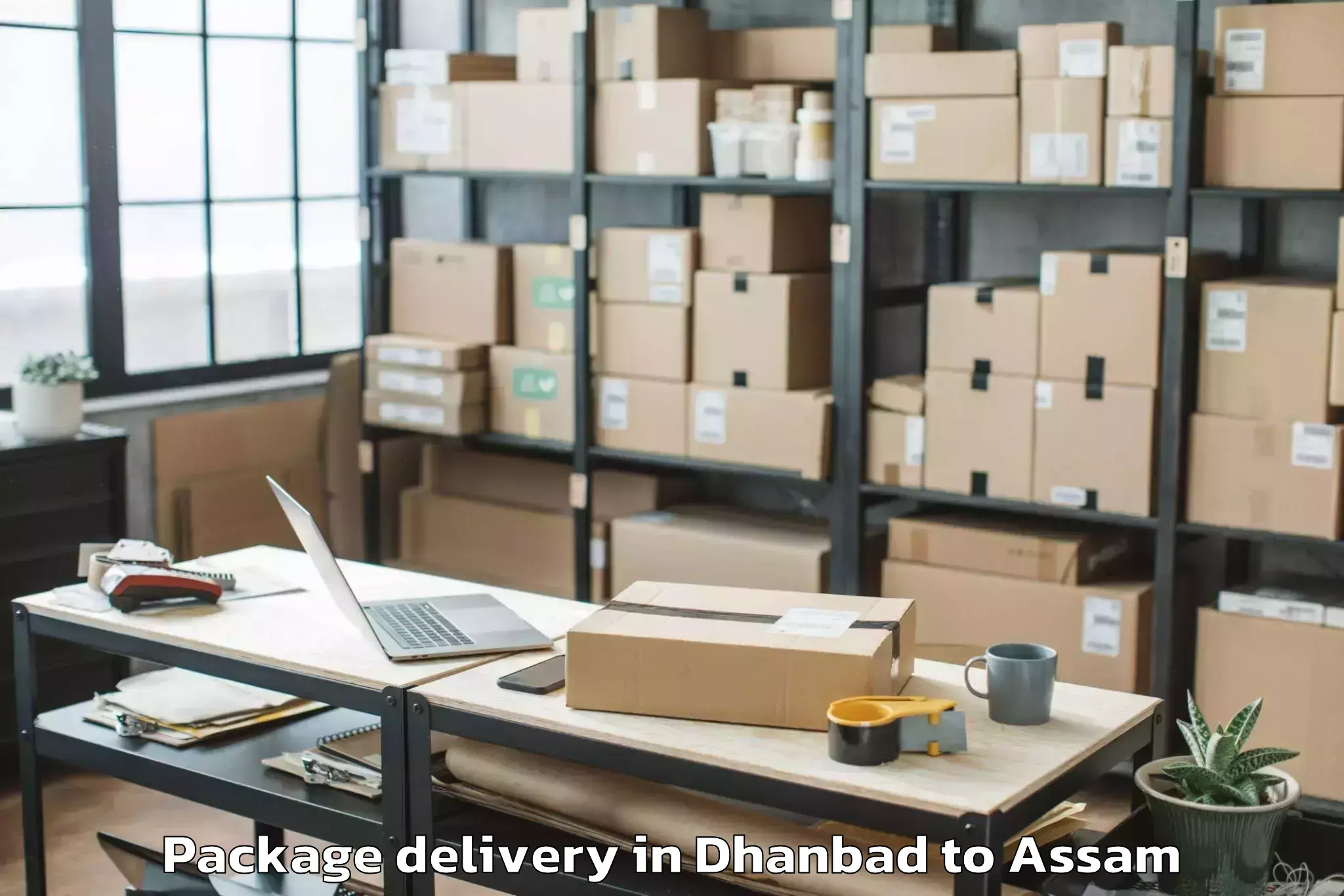 Easy Dhanbad to Darangamela Package Delivery Booking